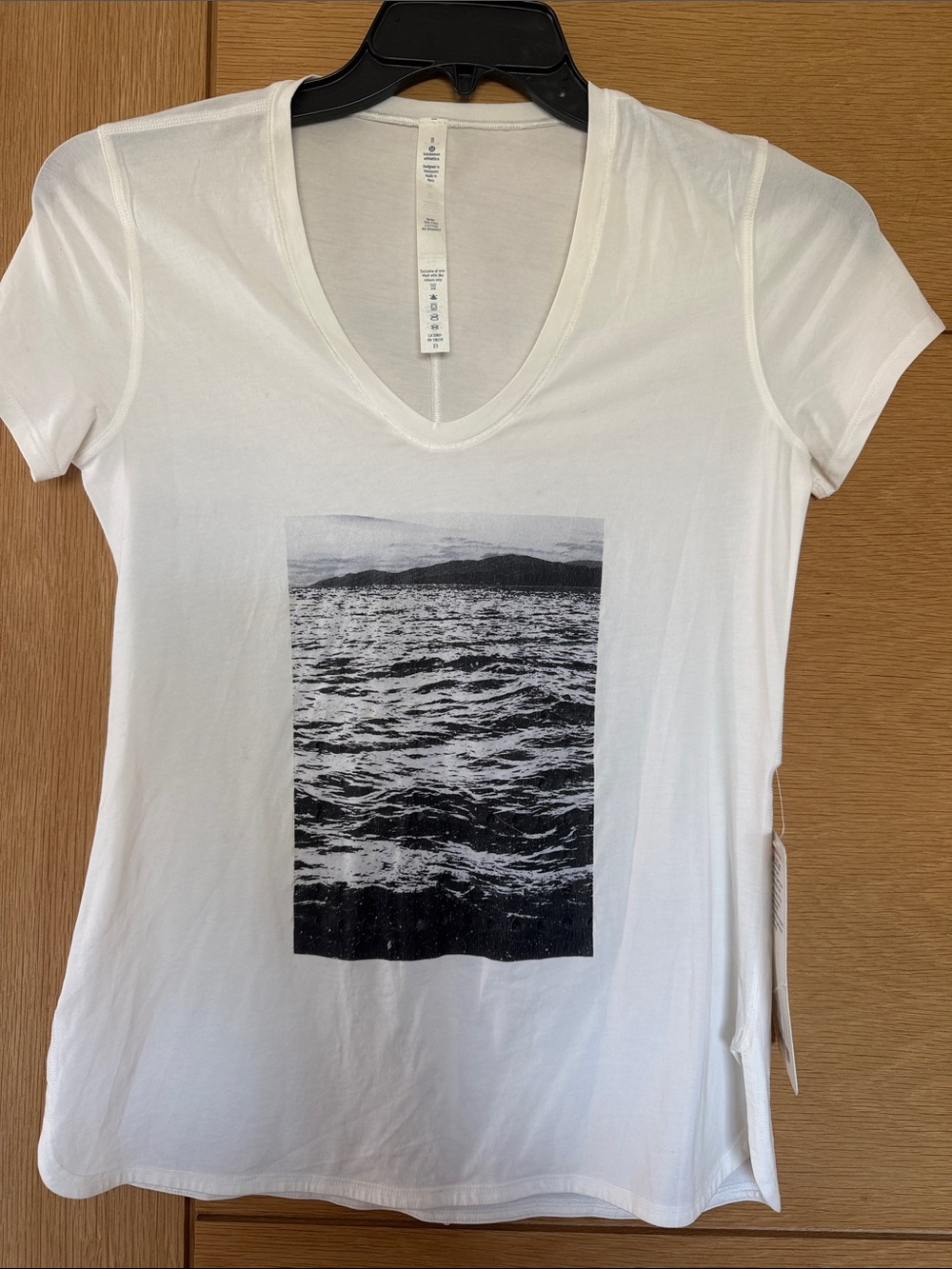lululemon Women's White V-Neck Graphic Tee with Black Ocean Print